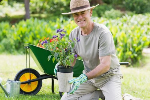 Professional landscaper working on a Palmers Green property